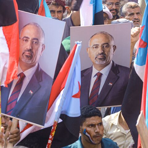 Yemenis brandishing the People's Republic of South Yemen flag 