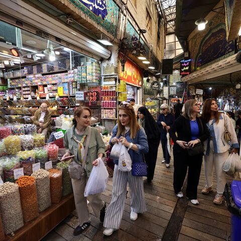 shoppers walking through the Tajrish Bazaar, a traditional market in Tehran