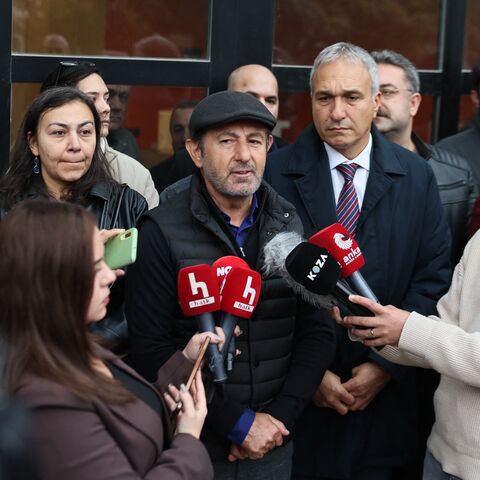 Serhan Asker, General Program Coordinator at Halk TV, makes a statement outside the Ankara branch of Turkey's most-watched news channel, Halk TV.