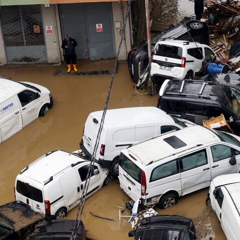 Abandoned cars piled up among debris and standing water following extremely heavy rainfall, Istanbul, Turkey, Oct. 15, 2026. 