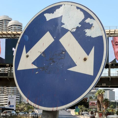 a large billboard featuring Israeli Prime Minister Benjamin Netanyahu 
