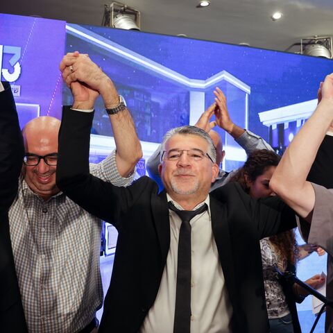Yousef Jabareen, leader of Israel's Arab-led Joint List political alliance (C-L), and other members cheer at the alliance's campaign headquarters in the northern Israeli city of Nazareth on Oct. 27, 2026.