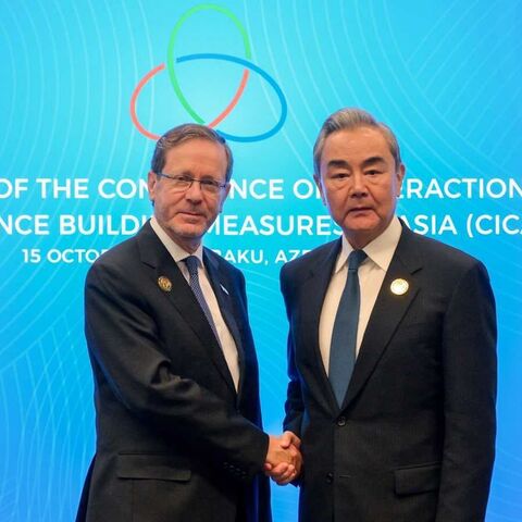 Israeli President Isaac Herzog and Chinese Foreign Minister Wang Yi at the  the Conference on Interaction and Confidence-Building Measures in Asia, Baku, Azerbaijan, Oct. 15, 2026.