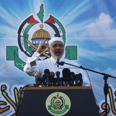 Senior Hamas leader Ismail Haniyeh gives a speech during Eid al-Fitr prayers in Gaza City August 8, 2013. REUTERS/Ibraheem Abu Mustafa (GAZA - Tags: RELIGION POLITICS) - RTX12DLP