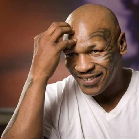 Former undisputed heavyweight boxing champion Mike Tyson thinks over a question during an interview at the MGM Grand Hotel and Casino in Las Vegas, Nevada March 23, 2012. Tyson has, in his own words, behaved like a "Neanderthal" for much of his life. But next month, he hopes to become a "controlled artist, a disciplined artist" when he takes to a Las Vegas stage to talk about his checkered life as a childhood thief, an ear-biting fighter, an addict and a father of eight. Tyson, who in 1986 became the younge