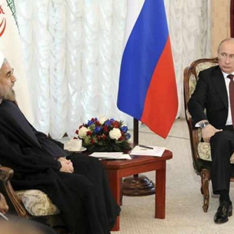 Russia's President Vladimir Putin (R) meets with his Iranian counterpart Hassan Rouhani during the Shanghai Cooperation Organization (SCO) summit in Bishkek, September 13, 2013. Rouhani said on Friday that he wanted a swift resolution to a dispute over Tehran's nuclear programme, which Western states fear is aimed at developing nuclear weapons.  REUTERS/Mikhail Klimentyev/RIA Novosti/Kremlin (KYRGYZSTAN - Tags: POLITICS) ATTENTION EDITORS - THIS IMAGE HAS BEEN SUPPLIED BY A THIRD PARTY. IT IS DISTRIBUTED, E