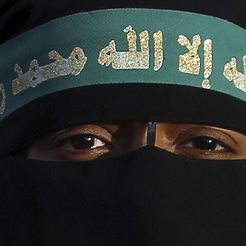 A supporter of the Muslim Brotherhood and ousted Egyptian President Mohamed Mursi takes part in a protest against the military near Rabaa al-Adaweya square in Cairo October 4, 2013. Five people were killed in clashes on Friday as supporters of deposed President Mohamed Mursi took to the streets of Cairo and other cities to demand the end of army-backed rule. The headband reads, "There is no god but Allah and Mohammed is his prophet." REUTERS/Amr Abdallah Dalsh  (EGYPT - Tags: POLITICS CIVIL UNREST) - RTR3FL