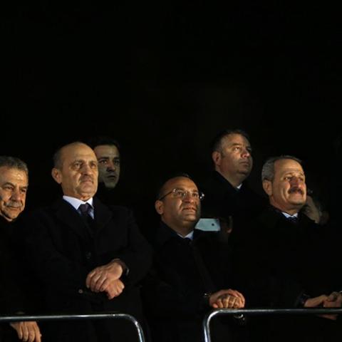 (From L to R) Turkey's European Affairs Minister Egemen Bagis, Interior Minister Muammer Guler, Environment and City Planning Minister Erdogan Bayraktar, Deputy Prime Minister Bekir Bozdag  and Economy Minister Zafer Caglayan listen as Prime Minister Tayyip Erdogan addresses his supporters at Esenboga Airport in Ankara December 24, 2013. Turkish ministers Caglayan and Guler resigned on Wednesday after their sons were arrested in a corruption investigation that has pitted the government against the judiciary