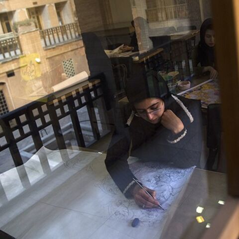 EDITORS' NOTE: Reuters and other foreign media are subject to Iranian restrictions on leaving the office to report, film or take pictures in Tehran. 
A student draws a pattern for a Persian handmade carpet as she sits in a classroom in Isfahan Art University, 450 km (280 miles) south of Tehran November 14, 2011. Persian carpet weaving is a historical part of Iranian culture, dating back to as far as approximately 2,000 years ago. Persian carpets can be mostly divided into three size groups: large (3x4 metre