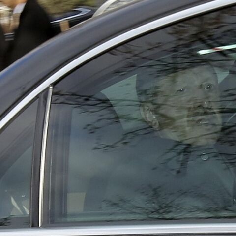 Turkey's Prime Minister Tayyip Erdogan arrives for the National Security Council meeting in his car at the Presidential Palace in Ankara February 26, 2014. Erdogan accused his enemies on Tuesday of hacking encrypted state communications to fake a phone conversation suggesting he warned his son to hide large sums of money before police raids as part of the inquiry.    REUTERS/Stringer (TURKEY - Tags: POLITICS CIVIL UNREST) - RTR3FQKO