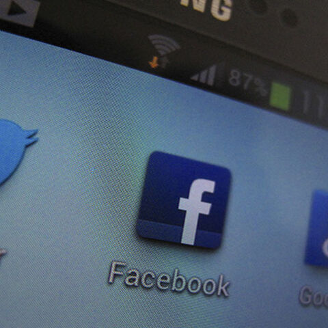 A Facebook icon is shown on a Samsung Galaxy III mobile phone in this photo illustration in Encinitas, California, January 30, 2013. Facebook Inc's advertising business grew at its fastest clip since before the company's May initial public offering, helping the company's revenue expand 40 percent to $1.585 billion. Facebook has ramped up its online advertising services in recent months, putting a greater emphasis on mobile ads and introducing capabilities that let marketers target Facebook users based on th