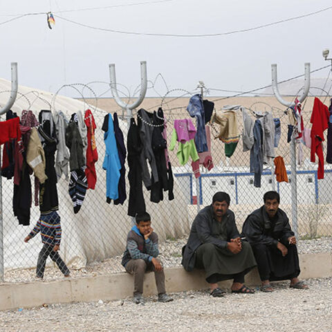 Syrian refugee men sit at a refugee camp in Nizip in Gaziantep province, near the Turkish-Syrian border March 17, 2014. Aleppo continues to bear the brunt of the civil war, in which about 140,000 people have died. Almost two years after rebels grabbed half of the city, they are now on the defensive, with government forces advancing on three sides. Turkey began building its refugee camps near the border in mid-2011, little knowing the war would last so long and bring such vast numbers of people, many of them