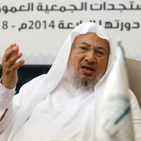Chairman of the International Union of Muslim Scholars Youssef al-Qaradawi speaks during a news conference in Doha June 23, 2014. The influential Sunni Muslim cleric said on Monday that only dialogue could solve Iraq's crisis, sounding a conciliatory note on the threat posed by Sunni Islamist insurgents that could further polarise the Middle East along sectarian lines. Picture taken June 23.     REUTERS/Mohammed Dabbous (QATAR - Tags: RELIGION POLITICS CIVIL UNREST) - RTR3VSK2