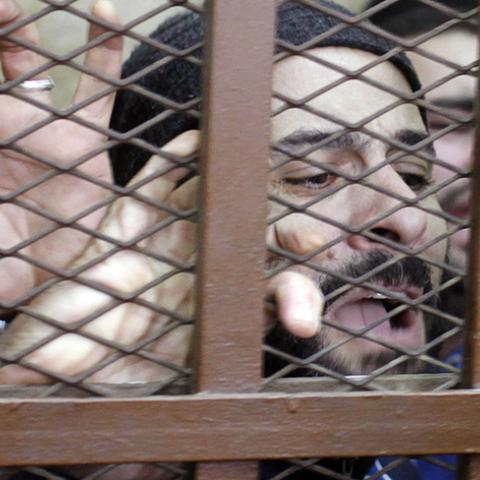 Defendants react after hearing the verdict at a court in Cairo January 12, 2015.  An Egyptian court on Monday ordered the release of 26 men who were detained last month in a raid on a Cairo bath house after police received a tip that they were holding gay orgies."The court has ruled that all the accused are innocent," the judge said.  REUTERS/Asmaa Waguih (EGYPT - Tags: POLITICS CRIME LAW CIVIL UNREST) - RTR4L2M4