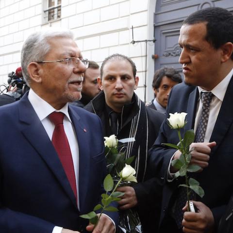 Tunisia's Foreign minister Taieb Baccouche (L) speaks with Imam of the municipal Drancy mosque in Seine-Saint-Denis, Hassen Chalghoumi (2R) on March 18 mars 2015 in front of the Tunisian embassy in Paris where people gathered in solidarity with victims of the Tunis's museum attack.  22 were killed including 20 tourists by two gunmen at Bardo International Museum on March 18, 2015 in Tunis. AFP PHOTO/FRANCOIS GUILLOT        (Photo credit should read FRANCOIS GUILLOT/AFP/Getty Images)