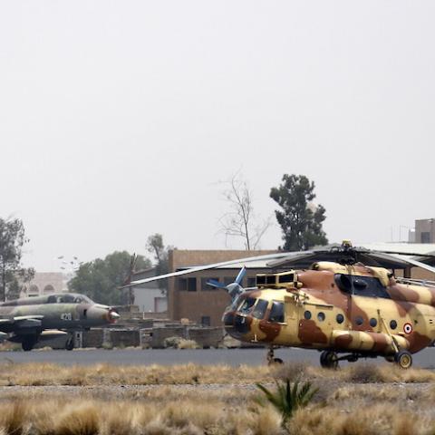 Yemeni Air Force MiG-21 fighters and a Mil Mi-17 helicopter are seen at an air base near Sanaa Airport March 28, 2015. REUTERS/Khaled Abdullah - RTR4V9D4