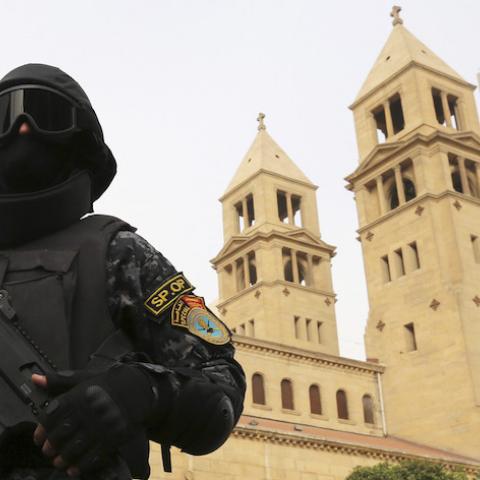 A special forces police officer stands guard to secure the area around Saint Mark's Coptic Orthodox Cathedral before a Coptic Christmas mass in Cairo January 6, 2015. Egypt's Coptic Christmas falls on Wednesday and security is typically tightened at churches ahead of the holiday after a string of attacks on Christian targets over the past years. REUTERS/Mohamed Abd El Ghany (EGYPT - Tags: RELIGION MILITARY CIVIL UNREST) - RTR4K8RY