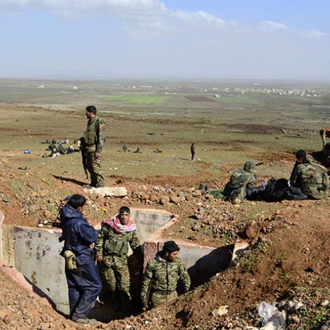 Fighters loyal to Syria's President Bashar Al-Assad rest on a hill after regaining control of Tal Fatima, a town south of Damascus, in the Daraa countryside March 1, 2015. Government forces say they've regained control of this and many other villages in the south - wresting them back from rebel hands.A general made the announcement on state television, saying a large number of Nusra Front fighters were killed and their weapons destroyed. The gains were said to happen on Friday and Saturday in a large offens
