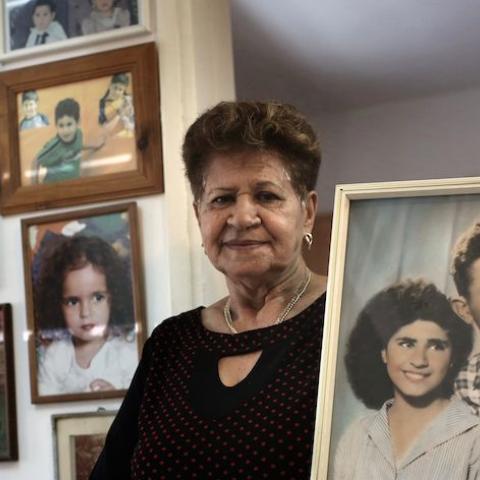 Yona Musa, 76, from a Yemeni descent, poses with a portrait of her and her husband on June 29, 2016 at her home in the Israeli city of Herzliya, near Tel Aviv. 
Musa is one of the thousands of Israelis, mainly from Jewish Yemenite families, who claim their babies were abducted more than 60 years ago and handed to adoption. Such stories of babies from immigrant families disappearing have been told in Israel for decades, but growing calls to unseal official documents on the allegations mean new light could so