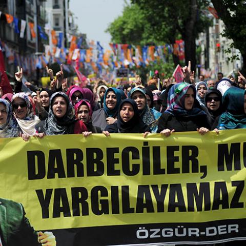 Pro-Islamist demonstrators hold a banner that reads "Coup leaders can't trial Mursi" during a protest in support former President Mohamed Mursi at the courtyard of Fatih mosque in Istanbul, Turkey, May 17, 2015. An Egyptian court on Saturday sought the death penalty for former president Mohamed Mursi and 106 supporters of his Muslim Brotherhood in connection with a mass jail break in 2011. Mursi and his fellow defendants, including top Brotherhood leader Mohamed Badie, were convicted for killing and kidnapp