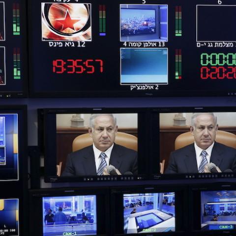 Israel's Prime Minister Benjamin Netanyahu is seen on monitors before the evening news bulletin at Channel 10's control room in Jerusalem November 18, 2015. Critics say Netanyahu, known as "Bibi," is hitting the wrong note when it comes to the media, weakening press freedom and holding sway over TV broadcasters in a country that bills itself as the Middle East's only true democracy. Picture taken November 18, 2015. To match Insight ISRAEL-NETANYAHU/MEDIA  REUTERS/Ronen Zvulun  - RTX1VG1F