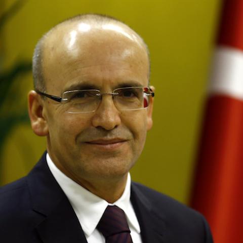 Turkish Deputy Prime Minister Mehmet Simsek poses during an interview with Reuters in Ankara, Turkey, December 23, 2015. Simsek said he expects gross domestic product to grow a higher-than-expected 3.5-4 percent this year and sees growth next year above the official 4 percent forecast. Picture taken December 23, 2015. To match Interview TURKEY-ECONOMY/SIMSEK REUTERS/Umit Bektas  - RTX1ZZ1V