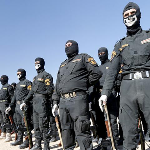 Iraqi Sunni Muslim fighters from Hashid Shaabi (Popular Mobilization) take part in a parade during a ceremony marking the Iraqi Police Day at Amiriyat al-Fallujah in Anbar province, January 9, 2016. REUTERS/Thaier Al-Sudani - RTX21NI3
