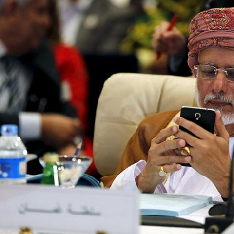 Oman's Minister of Foreign Affairs Yusuf bin Alawi bin Abdullah looks at his mobile phone at the foreign ministers of the Arab League meeting ahead of the Arab Summit in Sharm el-Sheikh, in the South Sinai governorate March 26, 2015. The Arab League on Thursday pledged full support for the Saudi-led campaign against Shi'ite Houthi fighters in Yemen.  REUTERS/Amr Abdallah Dalsh  - RTR4UZLE