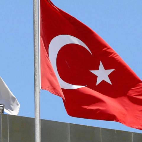 A Turkish flag flutters atop the Turkish embassy as an Israeli flag is seen nearby, in Tel Aviv, Israel June 26, 2016.  REUTERS/Baz Ratner/File Photo - RTSOQGS