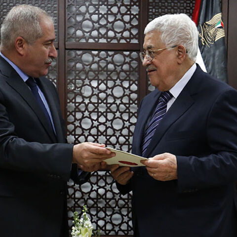 Palestinian Prime Minister Mahmud Abbas (R) meets with Jordanian Foreign Minister Nasser Judeh at the Muqataa, the Palestinian Authority headquarters in the West Bank city of Ramallah on December 28, 2016.  / AFP / ABBAS MOMANI        (Photo credit should read ABBAS MOMANI/AFP/Getty Images)