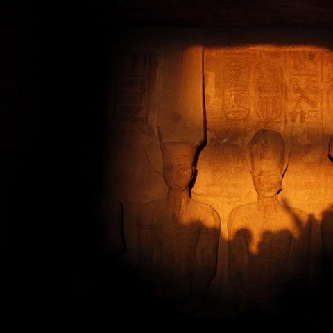 The light of dawn shines on the statues of Pharaoh Ramses II (R) and Amun, the God of Light (L), in the inner sanctum of the temple of Abu Simbel, located at the upper reaches of the Nile in Aswan, around 1264 km (785 miles) south of Cairo February 22, 2014. The axis of the temple was designed so as to allow the rays of the sun to shine into the inner sanctuary only on Ramses II's birthday and his coronation. A militant Islamist group has warned tourists to leaveEgypt and threatened to attack any who stay a