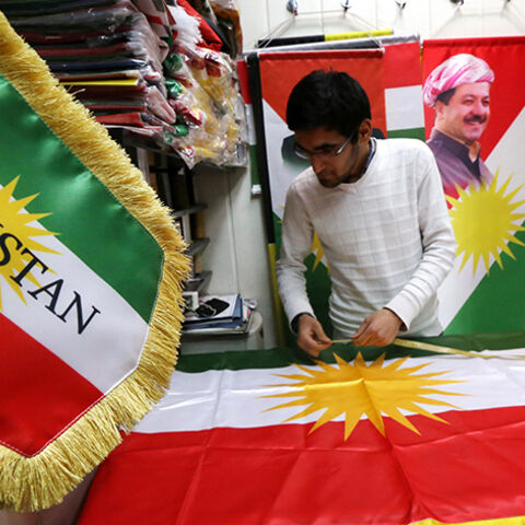 A man sews an Iraqi Kurdish flag bearing a portrait of Iraqi Kurdish leader Massud Barzani, in Arbil, the capital of the autonomous Kurdish region of northern Iraq, on February 3, 2016.  
Barzani has declared that the "time has come" for the country's Kurds to hold a referendum on statehood, his office said.

 / AFP / SAFIN HAMED        (Photo credit should read SAFIN HAMED/AFP/Getty Images)