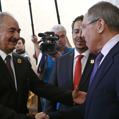 General Khalifa Haftar (L), commander in the Libyan National Army (LNA), shakes hands with Russian Foreign Minister Sergei Lavrov during a meeting in Moscow, Russia August 14, 2017. REUTERS/Sergei Karpukhin - RTS1BPIW