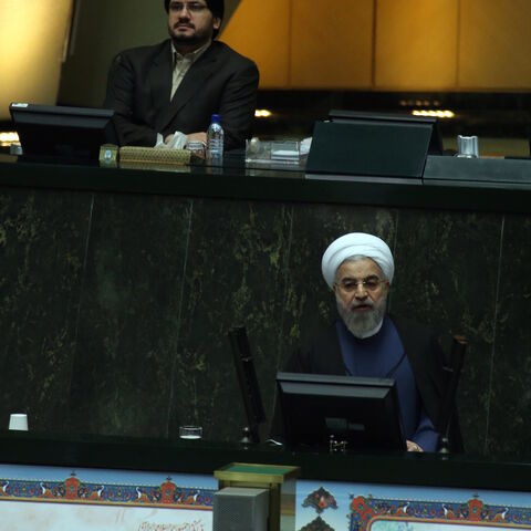 Iranian President Hassan Rouhani (bottom) delivers a speech to parliament before presenting the proposed annual budget in Tehran on December 7, 2014. Iran's parliament has adopted a law on December 4, to tax religious foundations and military-linked companies, a first for the Islamic republic that could generate hundreds of millions of dollars in revenues, media reported. AFP PHOTO/ATTA KENARE        (Photo credit should read ATTA KENARE/AFP/Getty Images)