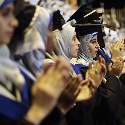 Palestinian students attend their graduation ceremony at the University College of Applied Sciences in Gaza City September 10, 2014. REUTERS/Ibraheem Abu Mustafa (GAZA - Tags: EDUCATION) - GM1EA9B0BV901