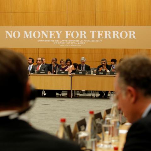 Participants attend a round table with international delegations at a conference to discuss ways of cutting funding to groups including Islamic State and al-Qaeda, at the Organisation for Economic Co-operation and Development (OECD) headquarters in Paris, France, April 26, 2018.  REUTERS/Philippe Wojazer/Pool - RC1775AF2BE0