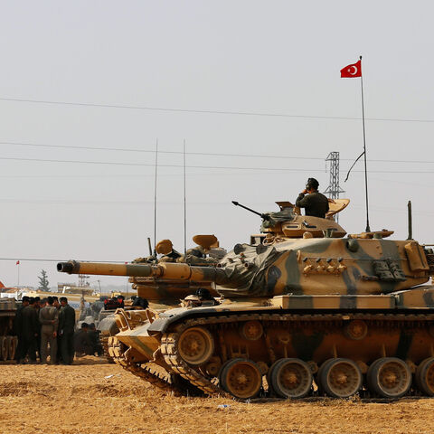 Turkish army tanks and military personal are stationed in Karkamis on the Turkish-Syrian border in the southeastern Gaziantep province, Turkey, August 25, 2016. REUTERS/Umit Bektas/File Photo - S1BEUGNIHMAA