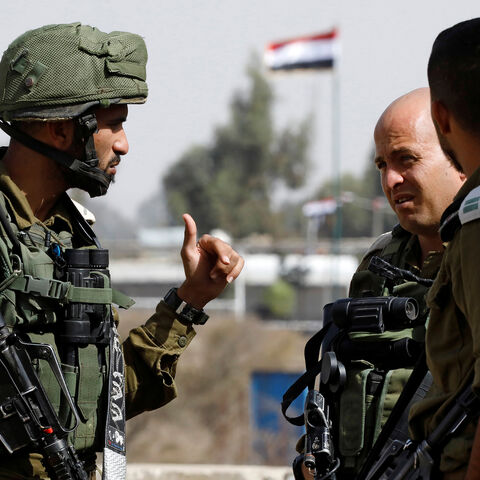 Israeli soldiers chat as they stand near the Quneitra crossing in the Golan Heights on the border line between Israel and Syria, October 15, 2018. REUTERS/Amir Cohen - RC1DE3AFB000