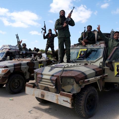 Libyan National Army (LNA) members, commanded by Khalifa Haftar, pose for a picture as they head out of Benghazi to reinforce the troops advancing to Tripoli, in Benghazi, Libya April 7, 2019. REUTERS/Esam Omran Al-Fetori - RC14EB305380