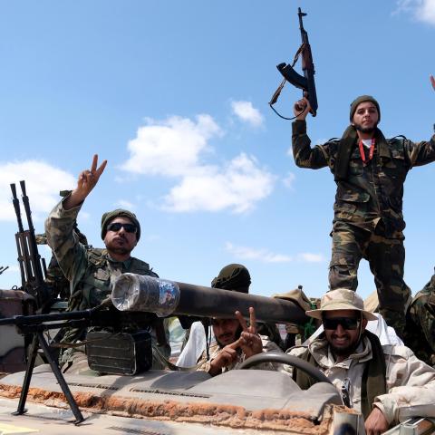 Libyan National Army (LNA) members, commanded by Khalifa Haftar, pose for a picture as they head out of Benghazi to reinforce the troops advancing to Tripoli, in Benghazi, Libya April 7, 2019. REUTERS/Esam Omran Al-Fetori - RC1AEB991490