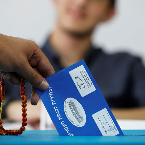 A man holds prayer beads while casting his ballot as Israelis began voting in a parliamentary election, at a polling station in the Bedouin city of Rahat in Israel's southern Negev Desert April 9, 2019. REUTERS/Amir Cohen - RC1EA7EA6CE0