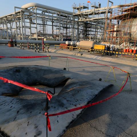 A metal part of a damaged tank is seen at the damaged site of Saudi Aramco oil facility in Abqaiq, Saudi Arabia, September 20, 2019. REUTERS/Hamad l Mohammed - RC1941E02750