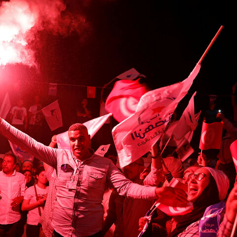 Supporters of Tunisia's moderate Islamist Ennahda party celebrate, after the party gained most votes in Sunday's parliamentary election, according to an exit poll by Sigma Conseil broadcasted by state television, in Tunis, Tunisia October 6, 2019. REUTERS/Zoubeir Souissi - RC1569FBC4D0