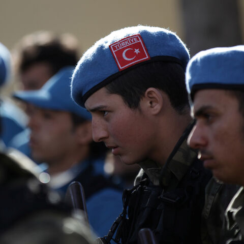 A member of the Free police, wearing a Turkish flag on his hat, attends a ceremony celebrating the inauguration of the "Free Police" in the Syrian border town of Jarablus January 24, 2017. REUTERS/Khalil Ashawi - RC11B36CD250