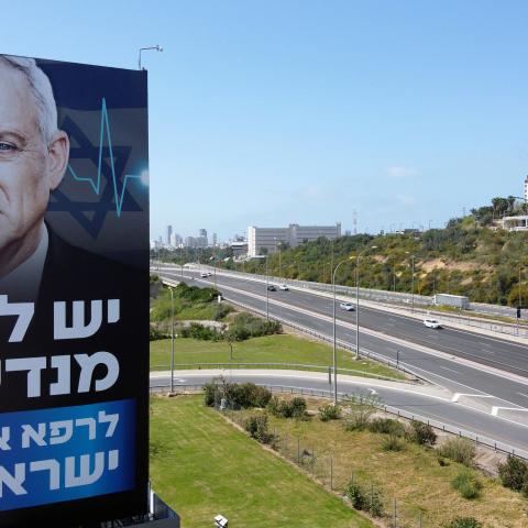 A billboard of Israeli Parliament speaker Benny Gantz is pictured along a highway in the Mediterranean costal city of Tel Aviv, on March 29, 2020. - Israeli Prime Minister Benjamin Netanyahu and his erstwhile rival Benny Gantz announced "significant progress" in talks towards forming an emergency unity government amid the novel coronavirus pandemic. (Photo by JACK GUEZ / AFP) (Photo by JACK GUEZ/AFP via Getty Images)