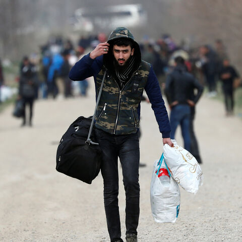 A migrant walks near Turkey's Pazarkule border crossing with Greece's Kastanies, in Edirne, Turkey, March 10, 2020. REUTERS/Murad Sezer - RC2WGF9OOAQ1