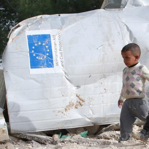 Palestinian boys walks past the remains of their family's dwelling, that was funded by the EU's humanitarian arm, after it was demolished by Israeli forces, near the West Bank village of Al-Eizariya, near east of Jerusalem January 21, 2016. In a development likely to further upset Europe, Israeli forces demolished six structures in the West Bank funded by the EU's humanitarian arm. The structures were dwellings and latrines for Bedouins living in an area known as E1 - a particularly sensitive zone between J