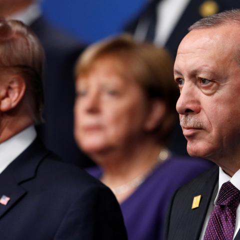 U.S. President Donald Trump and Turkey's President Tayyip Erdogan pose for a family photo during the annual NATO heads of government summit at the Grove Hotel in Watford, Britain December 4, 2019.  REUTERS/Peter Nicholls/Pool - RC2COD9N7WI1