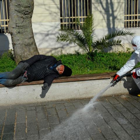 A member of the Fatih Municipality disinfects the Sultanahmet square in Istanbul to prevent the spread of the novel coronavirus (COVID-19) on March 21, 2020. - The religious affairs authority, Diyanet, ordered the closure of around 90,000 mosques in Turkey on March 20, the day of particularly important prayers in the Muslim faith. (Photo by BULENT KILIC / AFP) (Photo by BULENT KILIC/AFP via Getty Images)