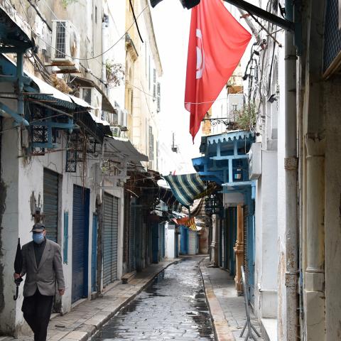 TUNIS, TUNISIA - 2020/04/20: A man wearing a protective face mask as a preventive measure against the spread of coronavirus walks through an alley of the souk in the Medina.
The lockdown imposed to help fight the spread of coronavirus pandemic in Tunisia has been extended for the 3rd time. Tunisia has recorded a total of 884 confirmed case, 148 recovered and 38 deaths by the corona virus disease. (Photo by Jdidi Wassim/SOPA Images/LightRocket via Getty Images)